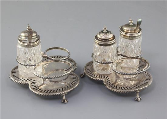 A pair of Victorian silver three division cruet stands by Edward Hutton, 13.8cm.